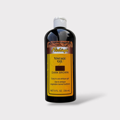 Bottle of Fiebing's Vintage Gel in dark brown on a light gray background