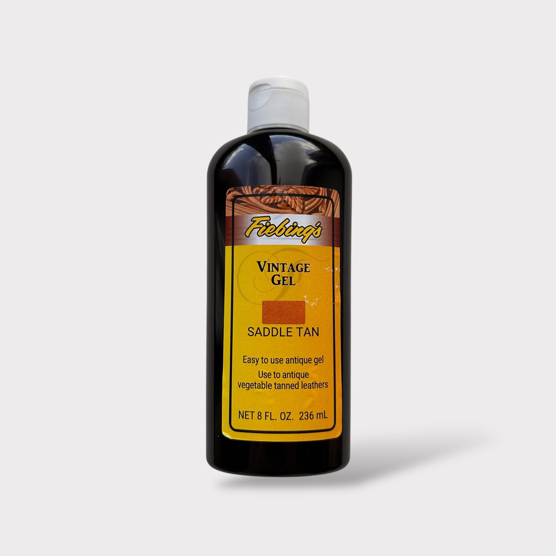Bottle of Fiebing's Vintage Gel Saddle Tan on a light gray background