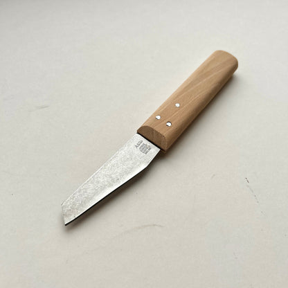 Knife with a wooden handle on a light gray background