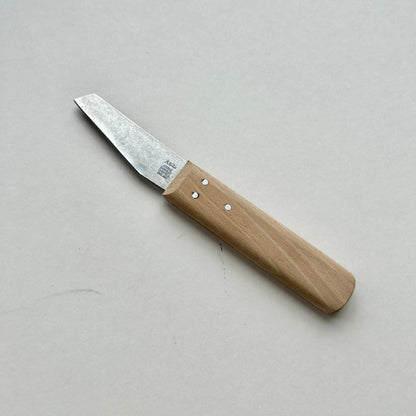 Knife with a wooden handle on a light gray background