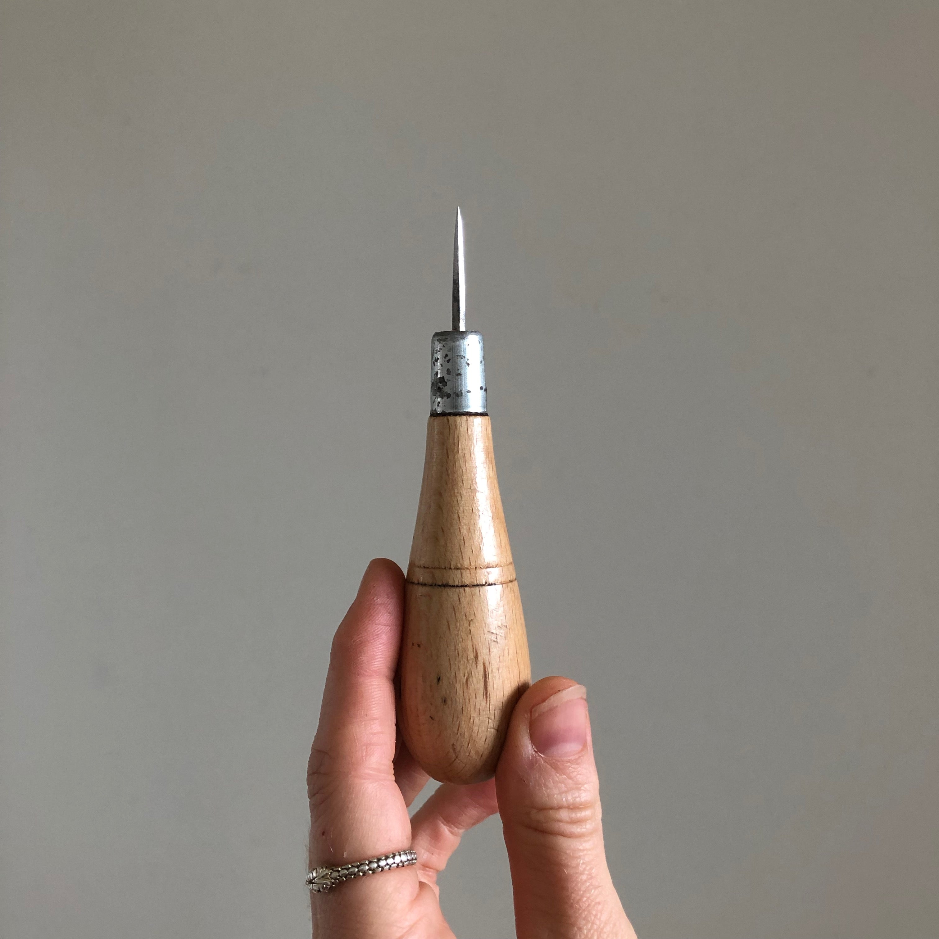 Diamond Leather Stitch Awl held in hand 