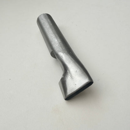 A metallic oblong punch for leather on a white background
