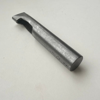 A metallic oblong punch for leather on a white background
