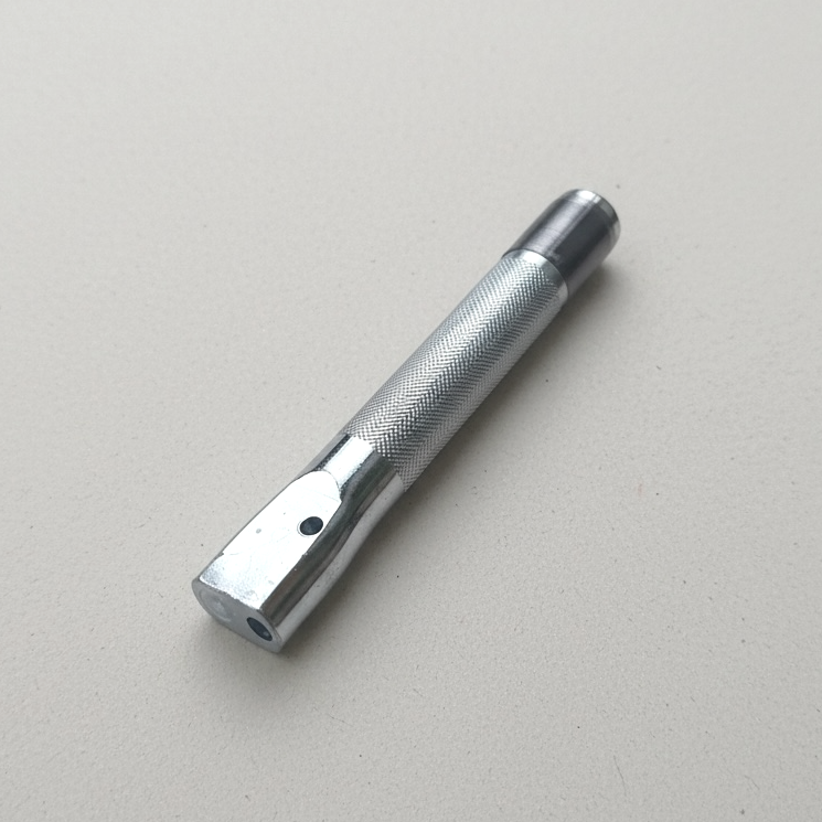 Silver colour rivet and burr setter tool on paper background