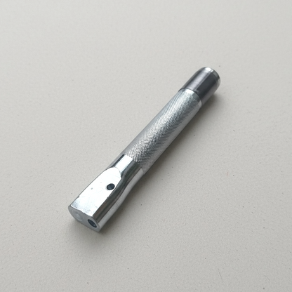 Silver colour rivet and burr setter tool on paper background