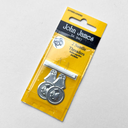 John James needle threaders in packaging on a gray background