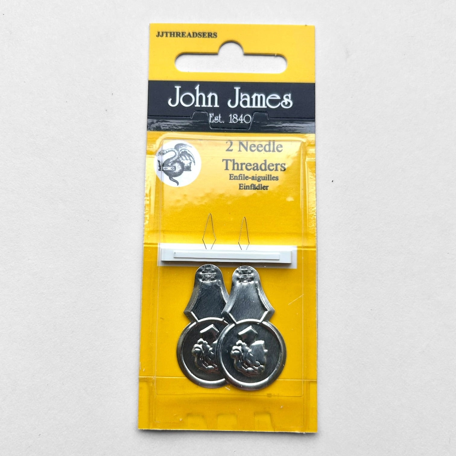 John James needle threaders in yellow packaging on a white background