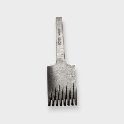 Metallic pricking iron leather tool with 'JOSEPH DIXON' engraving on a light gray background.