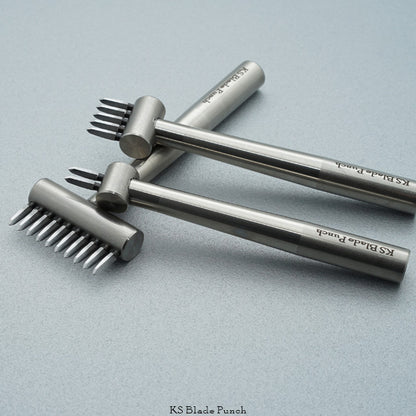 Three metal KS Blade Punches on a light grey background
