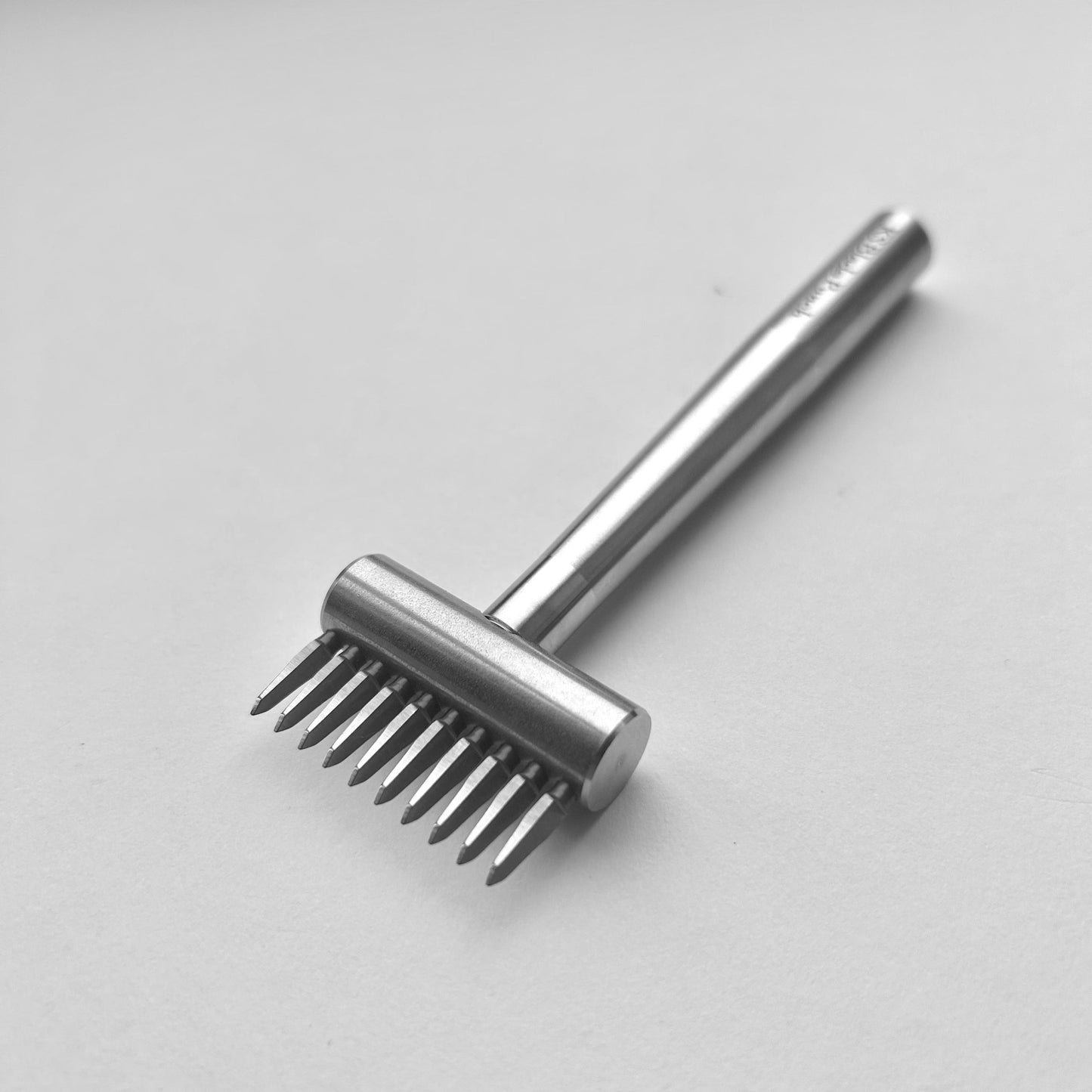 KS Blade Punch tool in silver colour on a white background