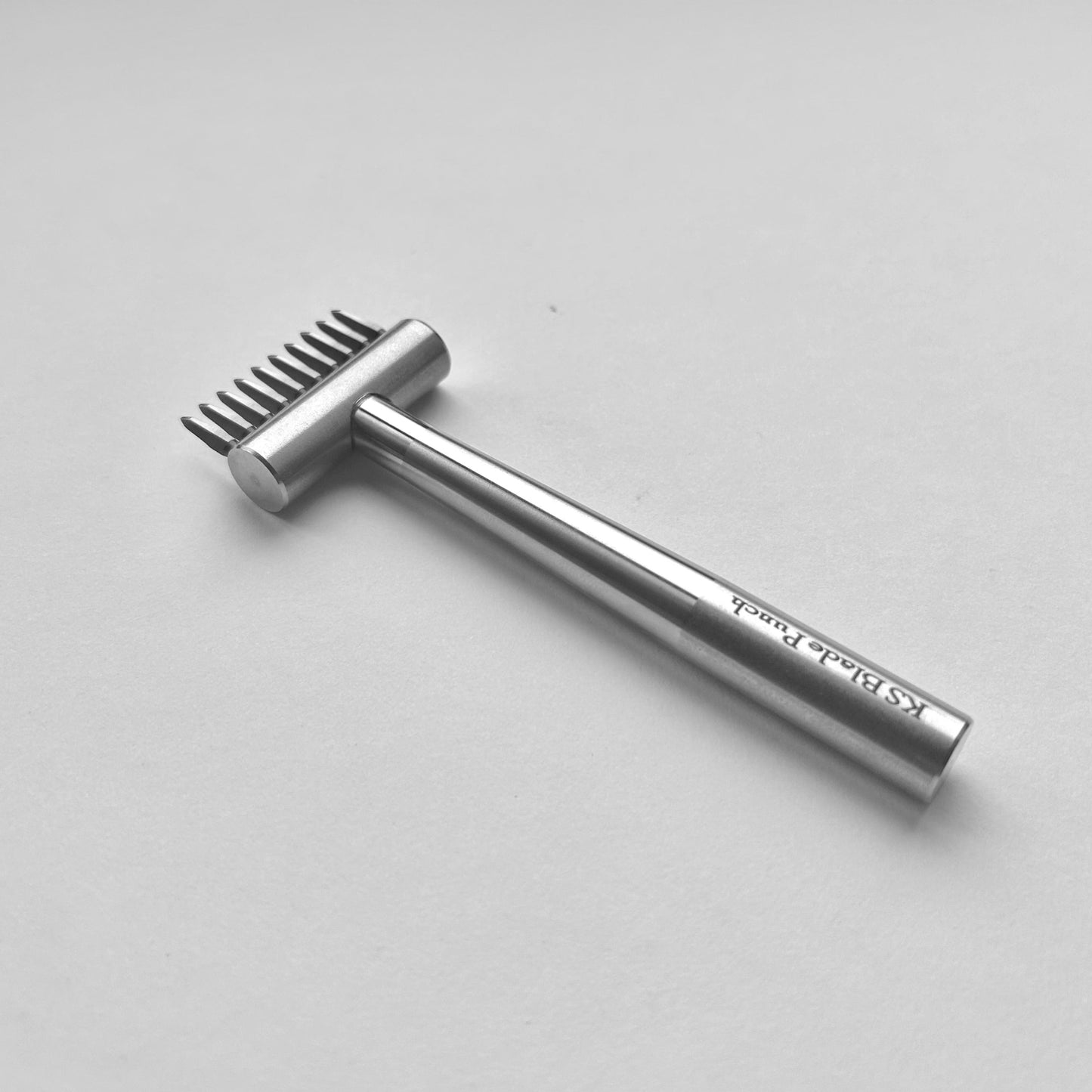 KS Blade Punch tool in silver colour on a white background