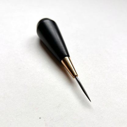 Black and gold leather diamond stitching awl by Kemovancraft on a white background