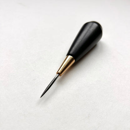Black and gold leather diamond stitching awl by Kemovancraft on a white background