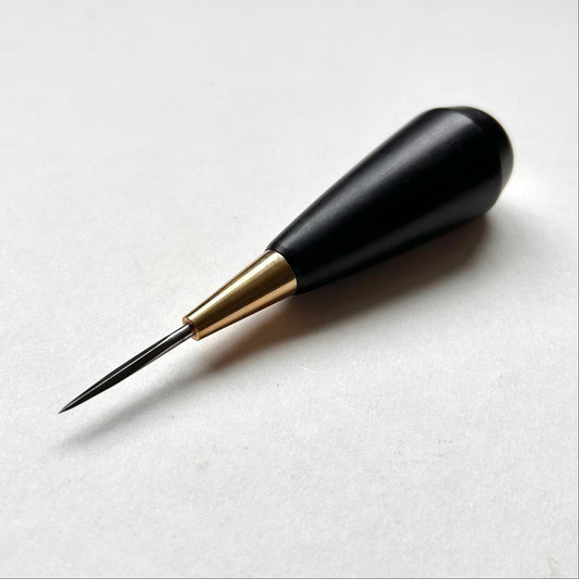 Black and gold leather diamond stitching awl by Kemovancraft on a white background