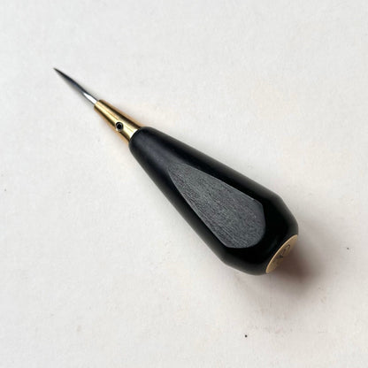 Black and gold leather diamond stitching awl by Kemovancraft on a white background
