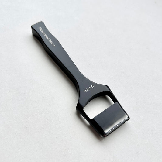 Black leather oblong slot punch tool with 'Kemovancraft' branding on a light gray background
