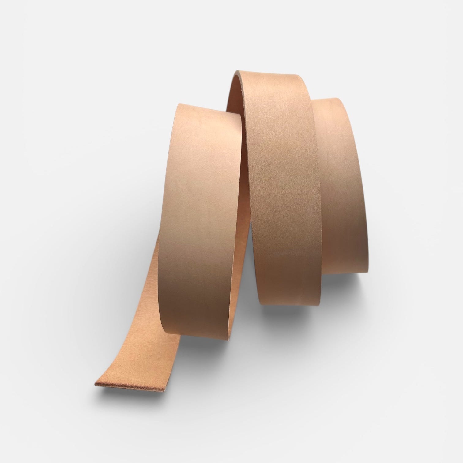 Natural leather belt blank on a light grey background