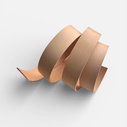 Natural leather belt blank on a light grey background