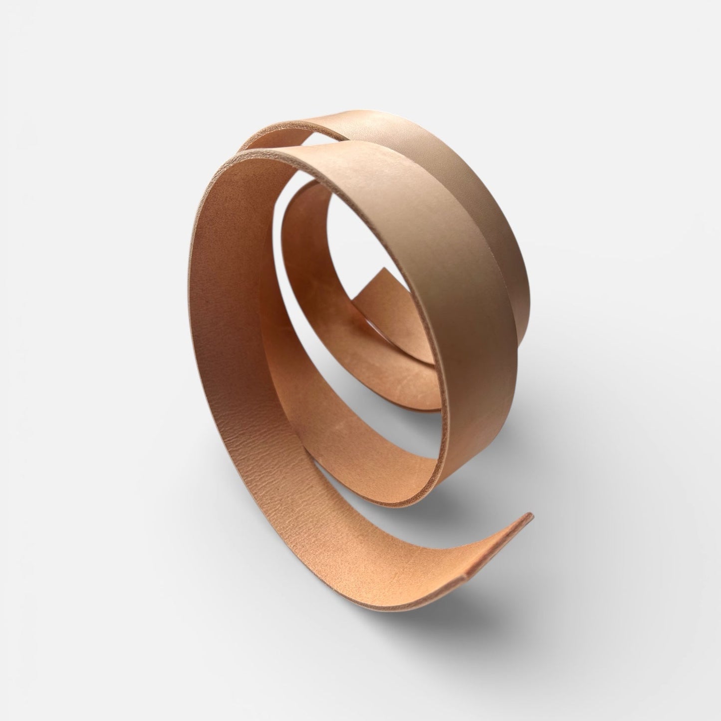 Natural leather belt blank on a light grey background