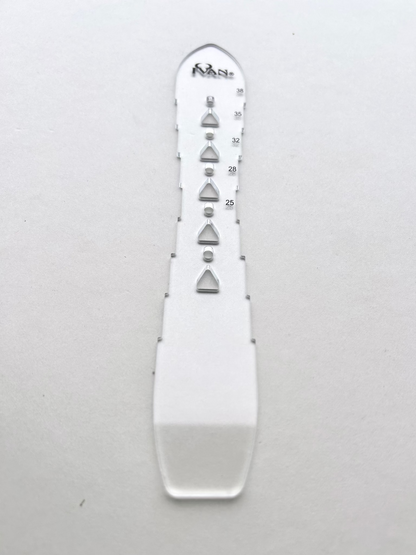 Leather belt hole template on a grey background