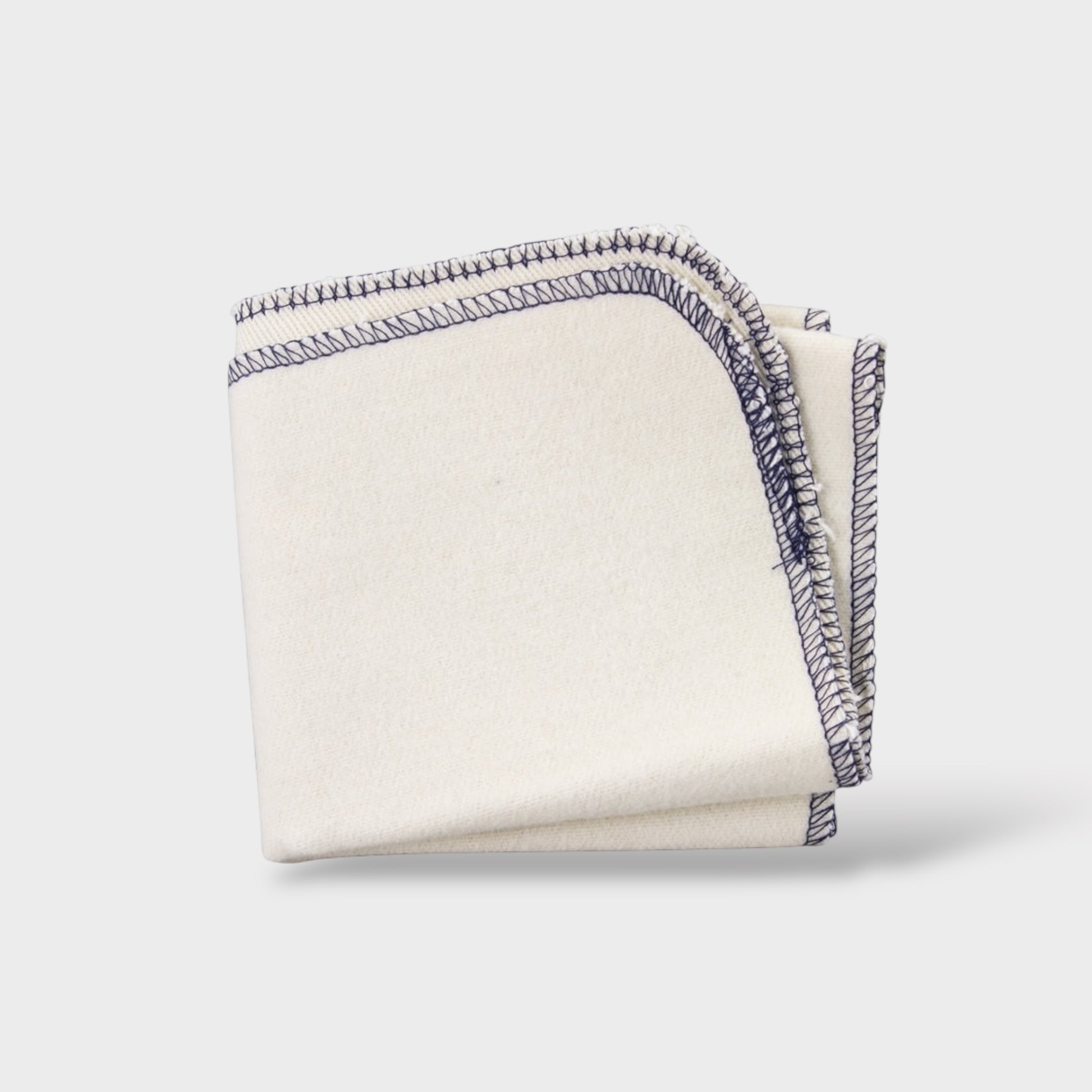 Folded fabric with decorative edge on a white background