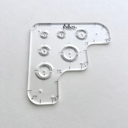 Leather wallet corner radius template on a grey background