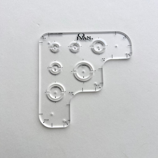 Leather wallet corner radius template on a grey background