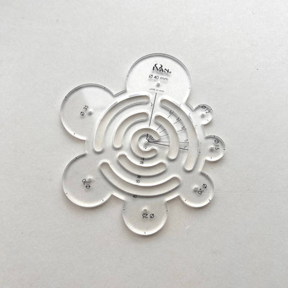 Clear plastic leather template on a white background