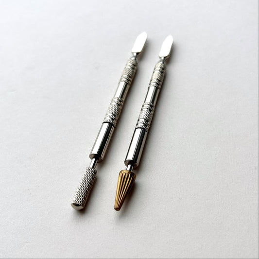 Two metallic leather edge dye pen tools with decorative patterns on a white background