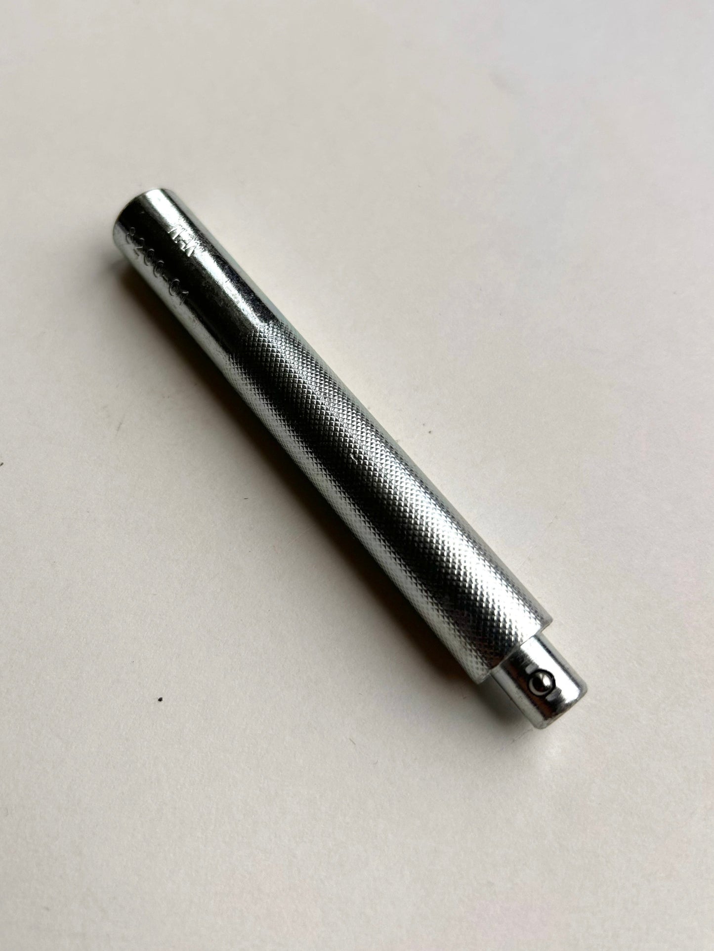 Metal leather embossing tool on a white background