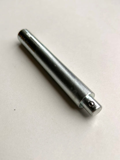 Metal leather embossing tool on a white background