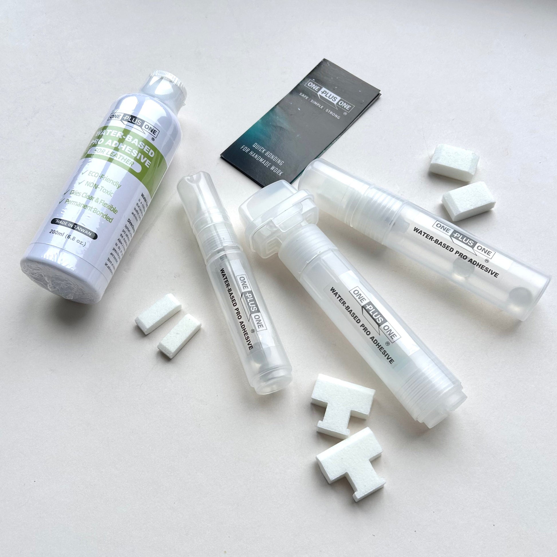 Set of adhesive products and small white blocks on a light gray background