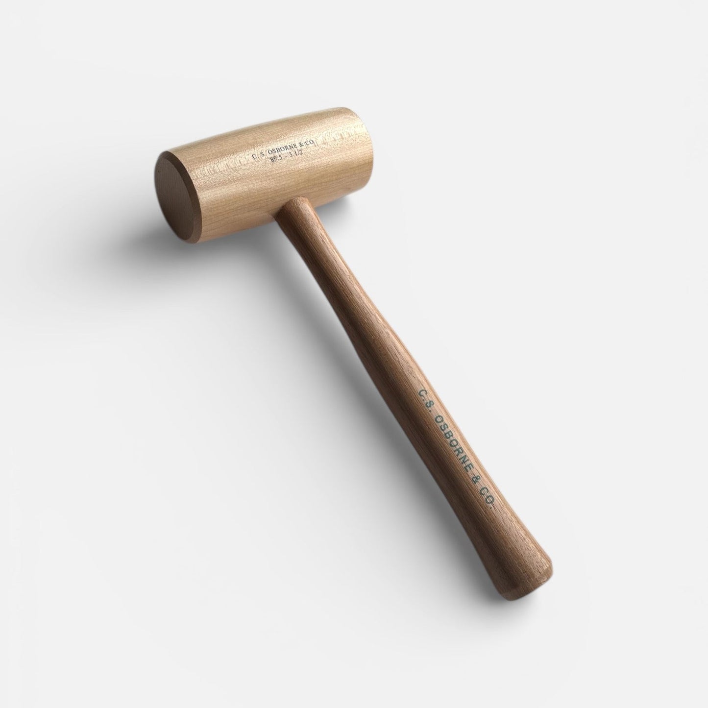 Wooden mallet on a light gray background