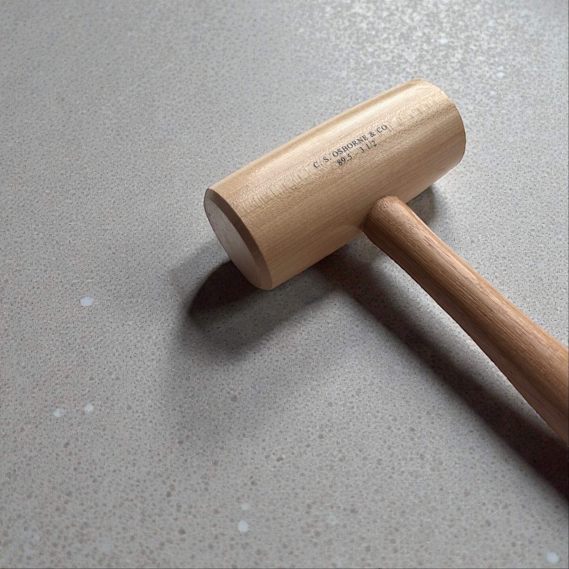 Wooden mallet on a gray surface
