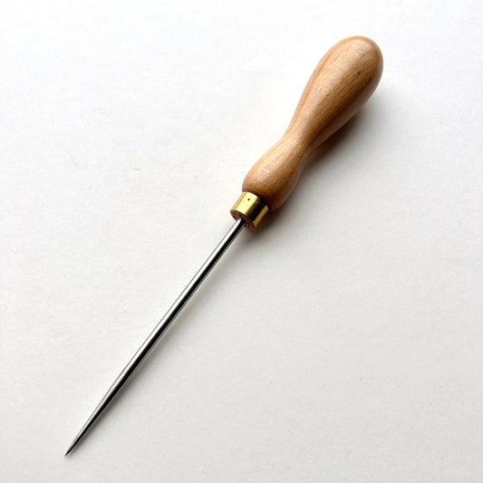 Wooden-handled scratch awl tool on a white background