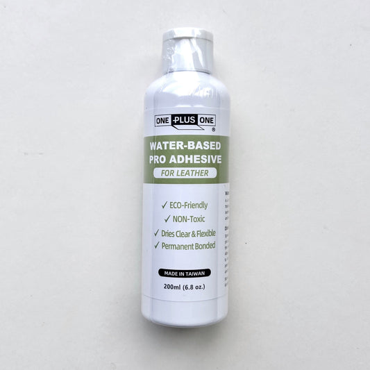 Bottle of water-based pro adhesive for leather on a white background