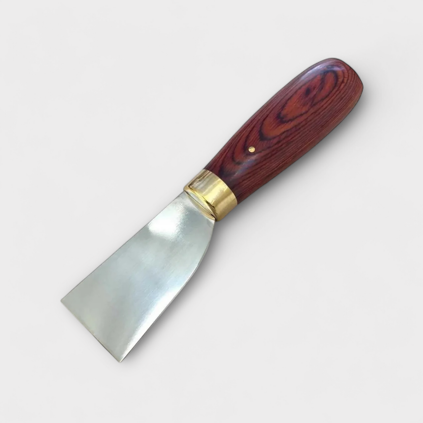 Wooden-handled leathe paring knife with metal blade on a white background