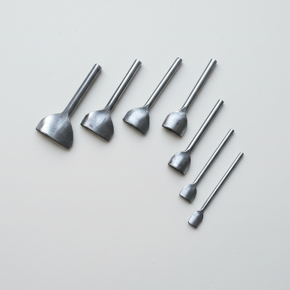 Leather round end punch set with a shallow arc