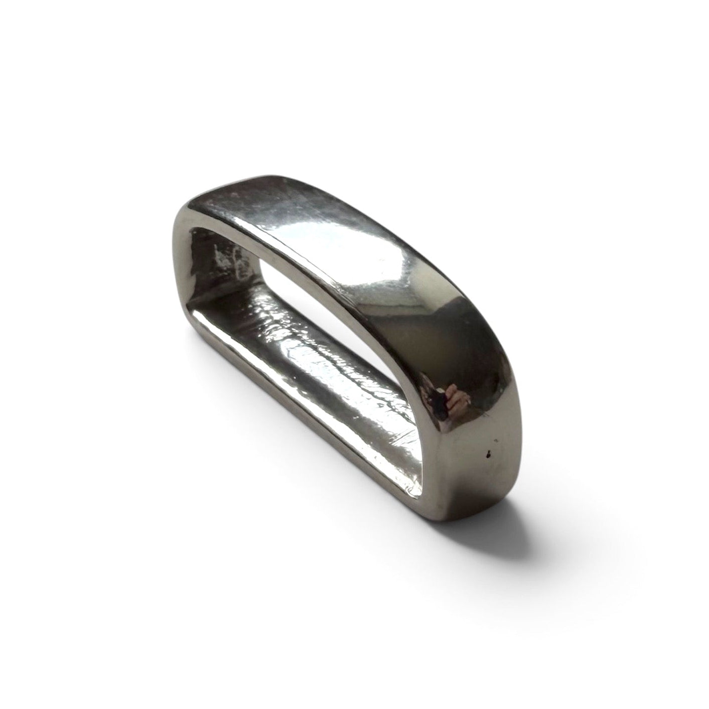 Silver belt loop keeper on a white backround