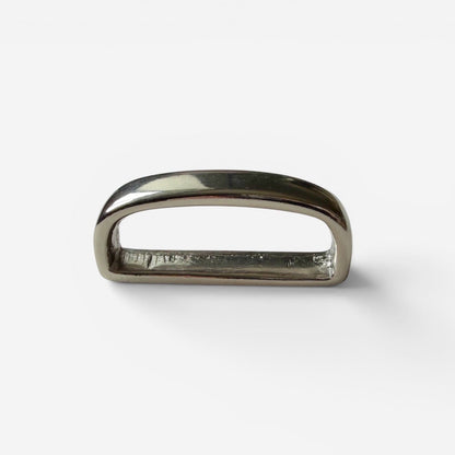 Silver belt loop keeper on a white backround