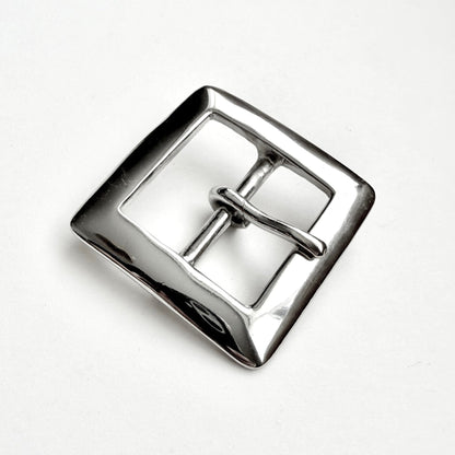 A polished silver-tone metal square buckle with a central bar and loop, photographed on a clean white background.