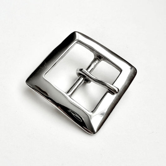A polished silver-tone metal square buckle with a central bar and loop, photographed on a clean white background.