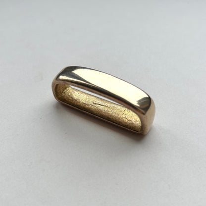 Solid brass belt loop keeper  on a white background
