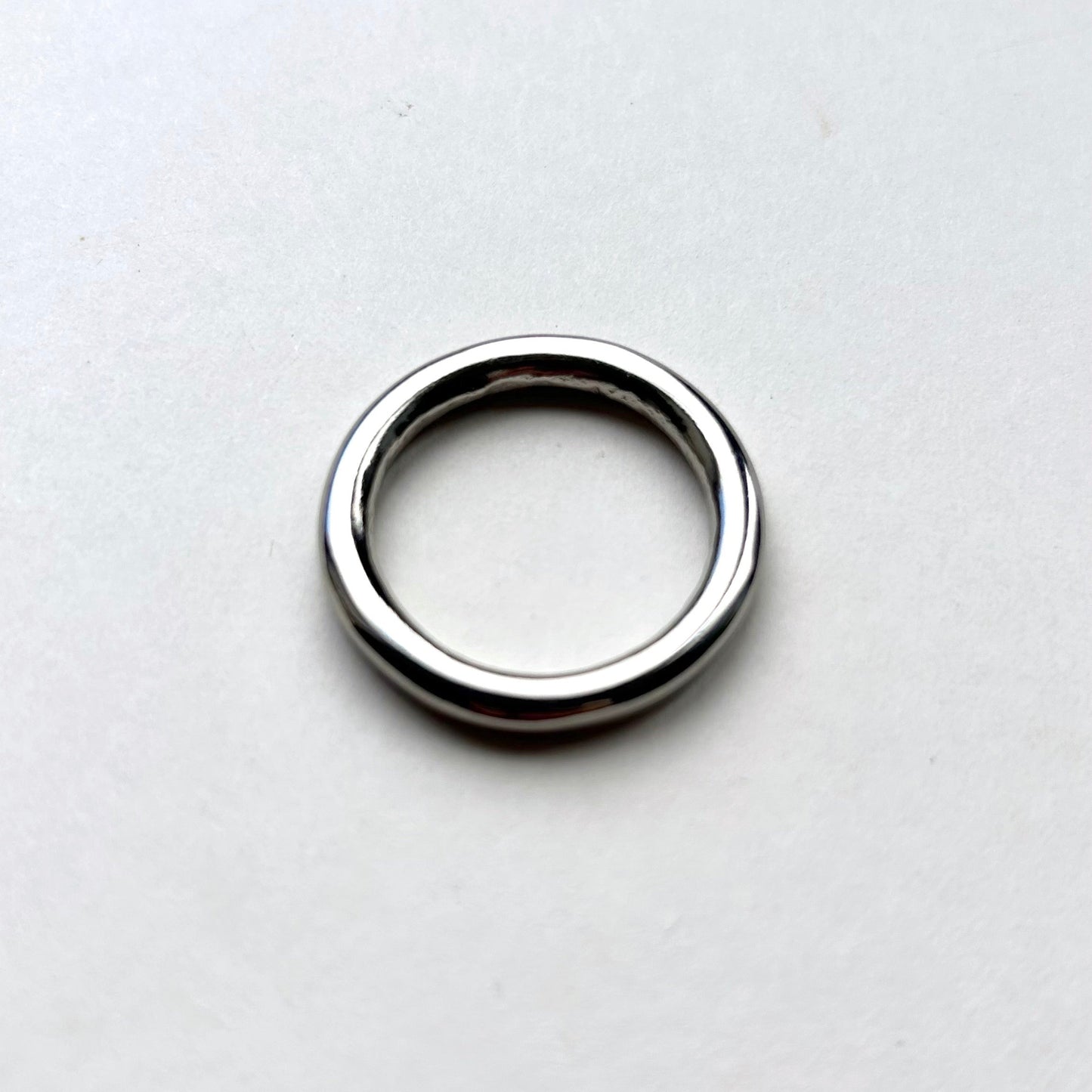 Silver o ring on a white background