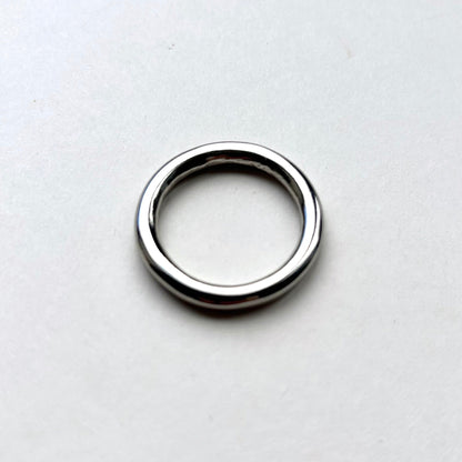 Silver o ring on a white background