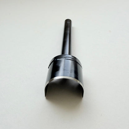 A black metal u shaped strap end punch with a silver steel cutting edge, shown on a plain light grey background.