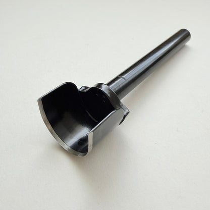 A black metal u shaped strap end punch with a silver steel cutting edge, shown on a plain light grey background.
