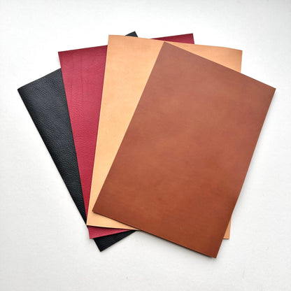 Set of leather panels in various colours on a white background