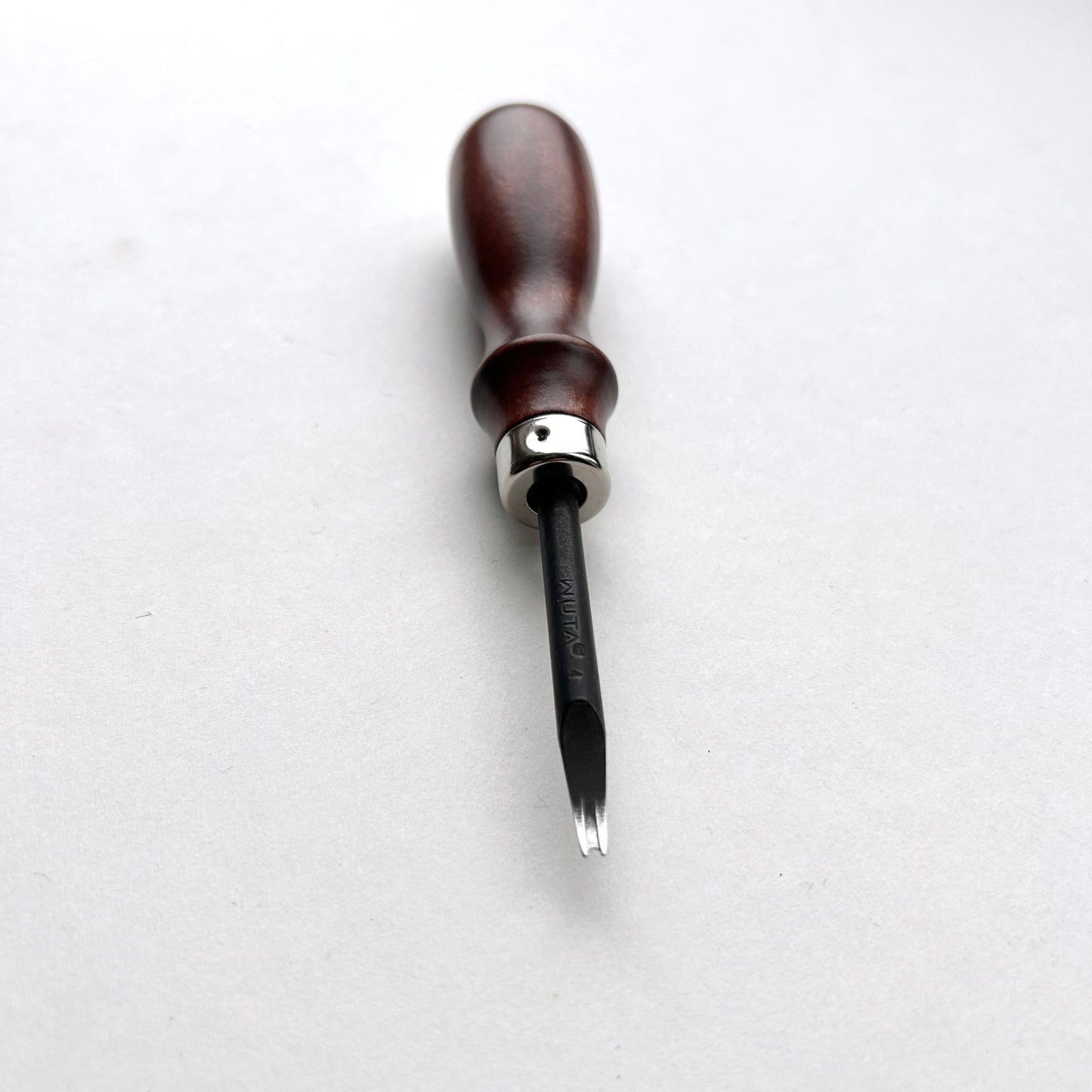 Wooden-handled WUTA leahter edge beveller tool with a metal blade on a white background