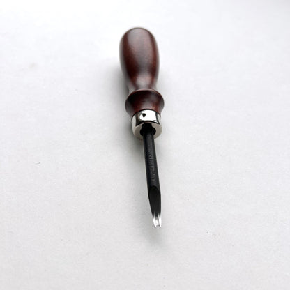 Wooden-handled WUTA leahter edge beveller tool with a metal blade on a white background
